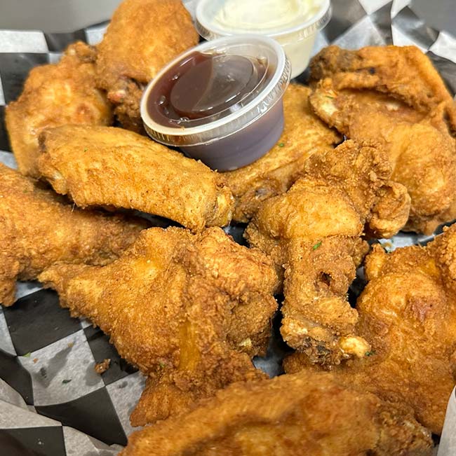 A basket of fried chicken wings from Features Sports Bar & Grill in Holmen Wisconsin.