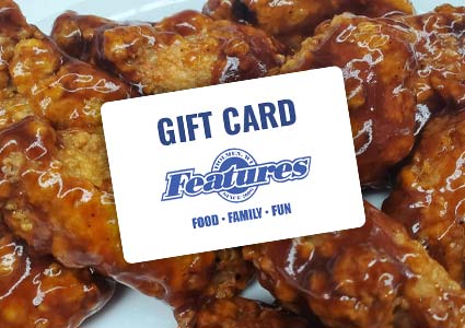 Gift card atop saucy wings at Features Sports Bar & Grill—Food • Family • Fun in Holmen Wisconsin.
