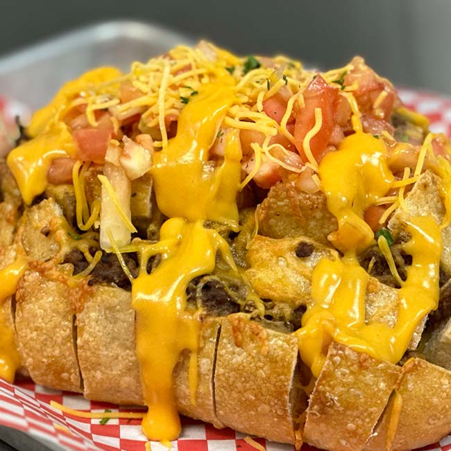 A Holmen Wisconsin favorite: bread with ground beef, cheese, and tomatoes at Features Sports Bar & Grill.