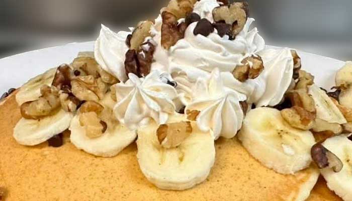 Enjoy Food like pancakes topped with banana, walnuts & more at Features Sports Bar & Grill.