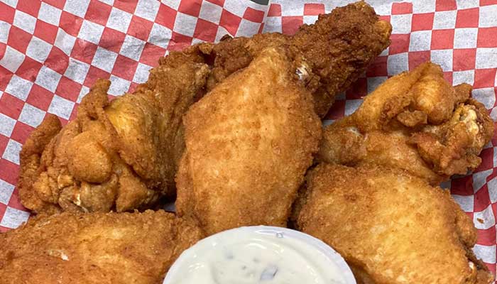 Fried chicken pieces with dipping sauce, perfect bar food in Holmen, Wisconsin.