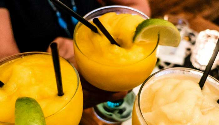 Three frozen margaritas with lime wedges at Features Sports Bar & Grill in Holmen, Wisconsin.