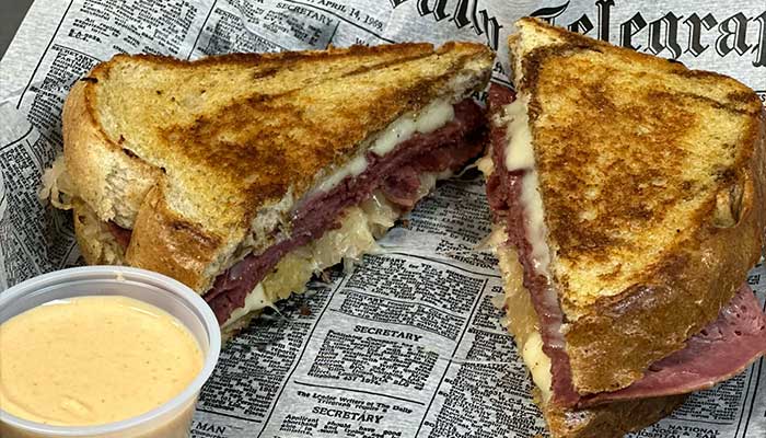 Grilled sandwich with meat and cheese, served at Features Sports Bar & Grill in Holmen Wisconsin.